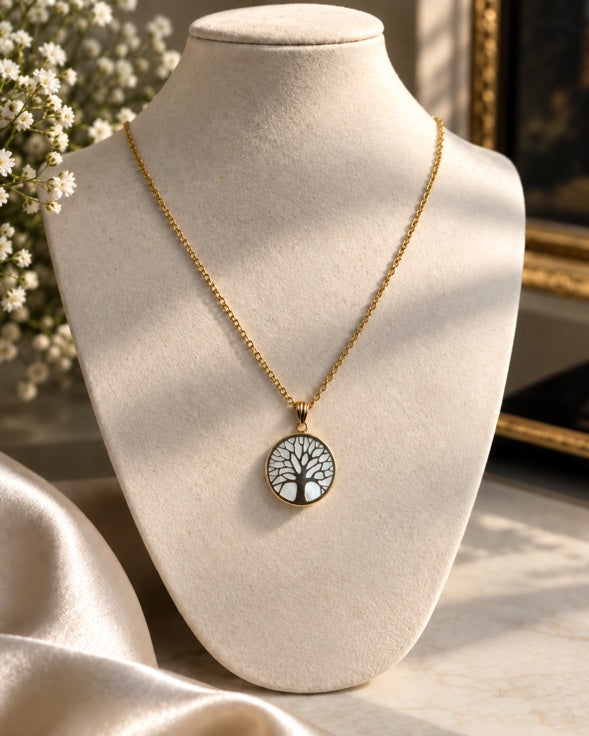 14K yellow gold Tree of Life pendant necklace on a jewelry bust