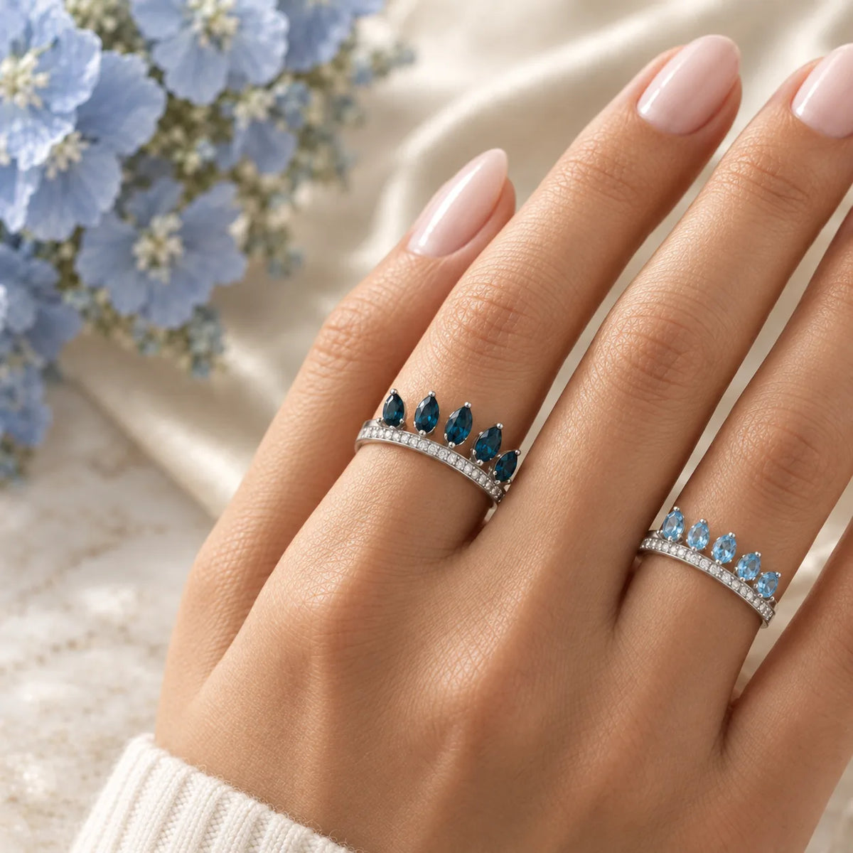 The two blue topaz rings worn separately: London blue topaz on one finger, Swiss blue topaz on another