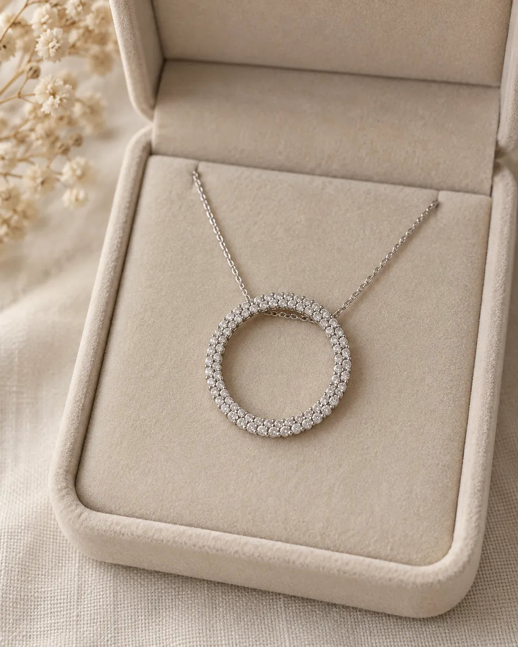 Diamond circle pendant necklace in 14K white gold with natural diamonds, in a beige velvet box