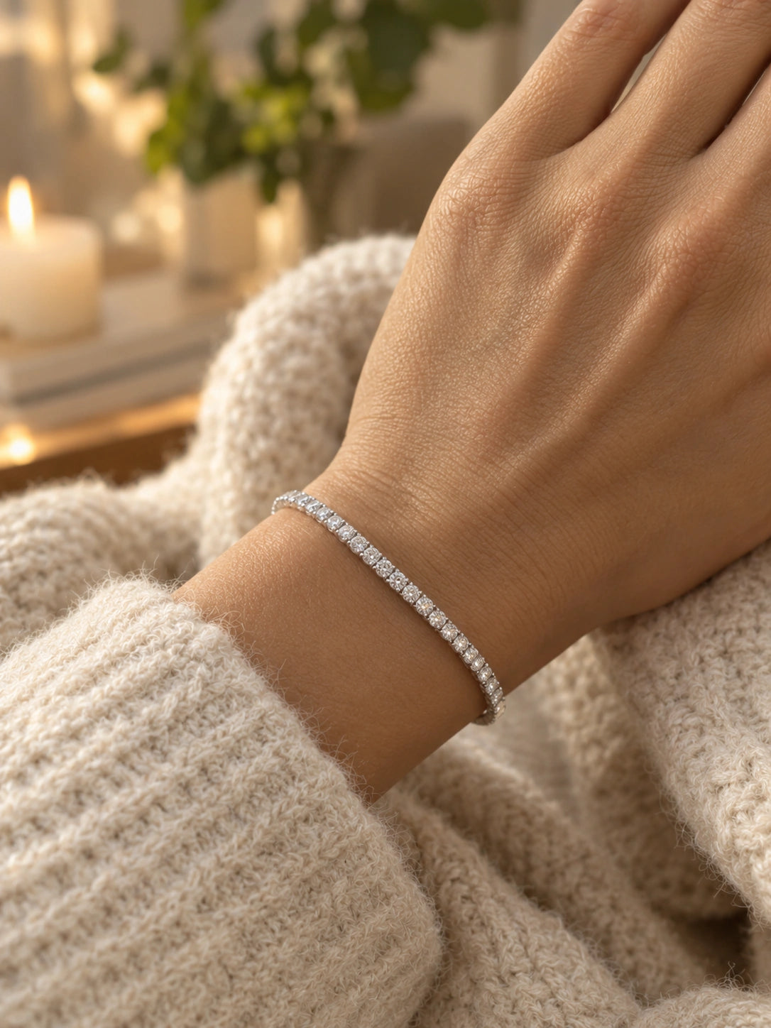 White gold diamond tennis bracelet worn on a wrist