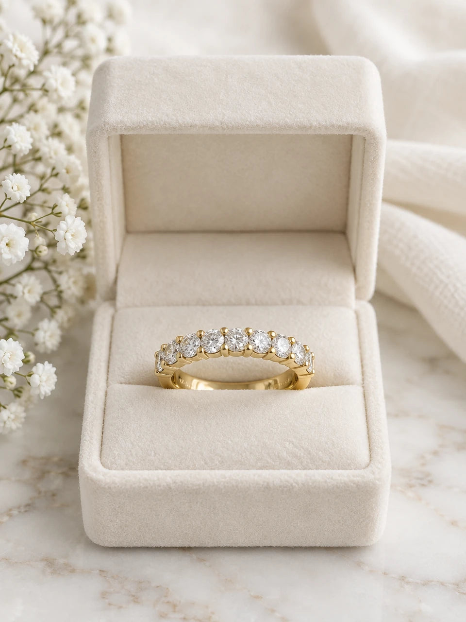 Half eternity ring in yellow gold with round diamonds, in a cream velvet box