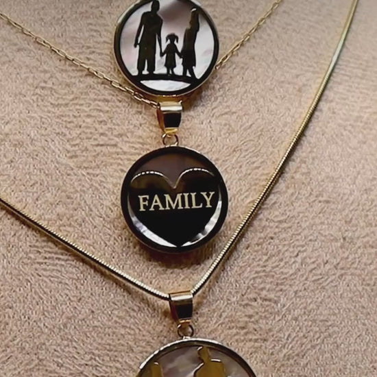 Close-up video of three GH Jewells family pendant necklaces in 14K gold and mother-of-pearl