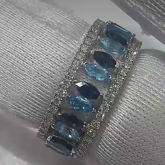 Close-up video of the London blue topaz crown ring set in white gold, worn as one ring and as two