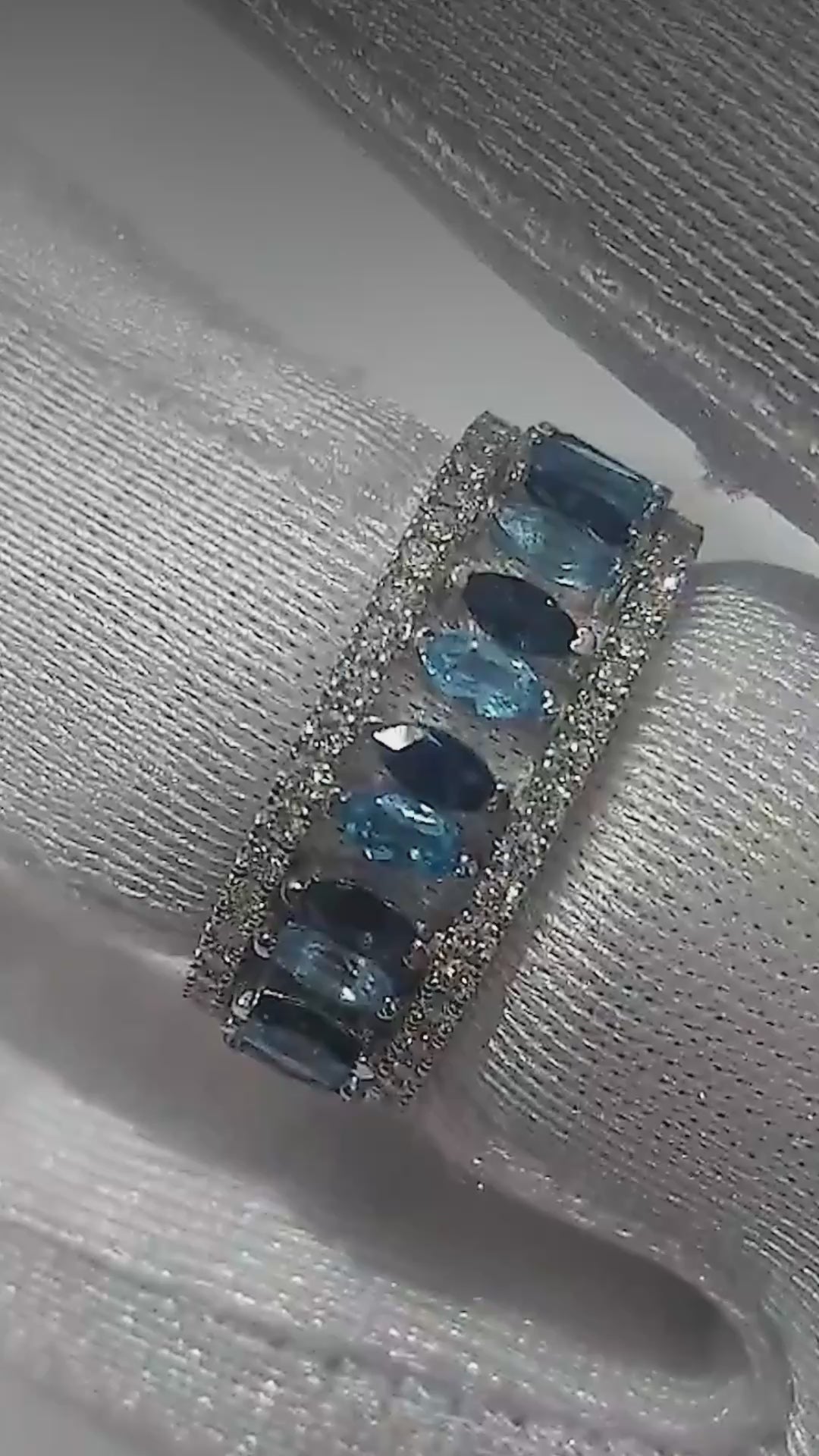 Close-up video of the London blue topaz crown ring set in white gold, worn as one ring and as two